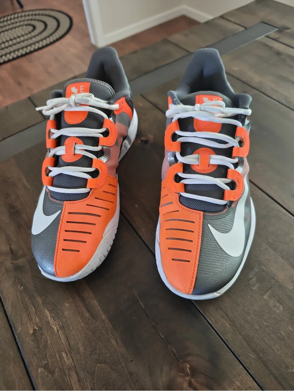 Nike Gray and Orange Athletic Sneakers with White Swoosh